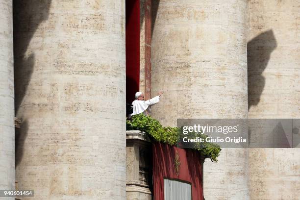 Pope Francis delivers his traditional 'Urbi et Orbi' Blessing to the City of Rome and to the World from the central balcony overlooking St. Peter's...