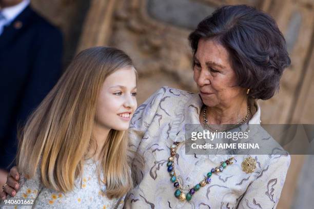 Princess Leonor of Spain stands with her grandmother former Queen Sofia after attending the traditional Easter Sunday Mass of Resurrection in Palma...