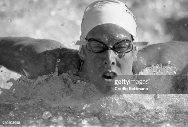 Laurie Lehner of Ratcliff, KY, swims her way to a gold medal in the women's 100-meter butterfly of the Pan American Games swimming competition in...