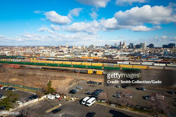 Aerial view of the skyline of downtown Newark, New Jersey, with freight yard and freight trains in the foreground, March 16, 2018.