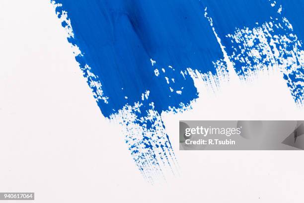 stroke blue paint brush - schmiererei stock-fotos und bilder