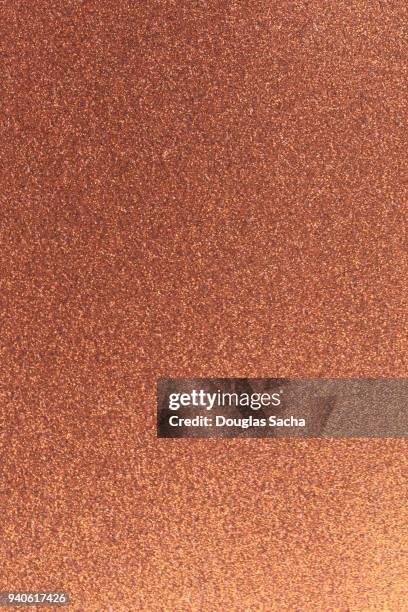 seamless sparkle pattern of copper colored glitter - bronzemedaille stock-fotos und bilder