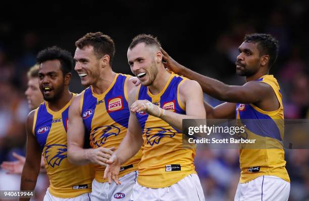 Daniel Venables of the Eagles is congratulated by his teammates after kicking a goal during the round two AFL match between the Western Bulldogs and...