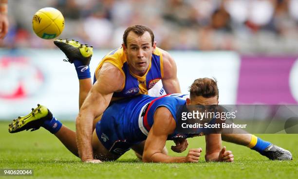 Luke Dahlhaus of the Bulldogs and Shannon Hurn of the Eagles compete for the ball during the round two AFL match between the Western Bulldogs and the...