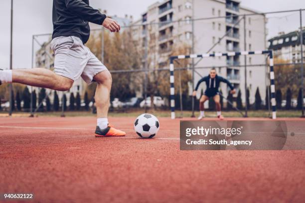 kicking soccer ball - penalty kick stock pictures, royalty-free photos & images