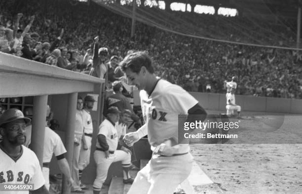 The captain of the Red sox, Carl Yastrzemski is all smiles after he belted a home run to lead of the 2nd inning of the Red Sox-Yankees sudden-death...