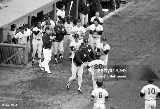 Bucky Dent, #20, is greeted by his teammates after hitting a three run home run in the 7th inning at Fenway Park giving the Yankees a 4-2 lead.