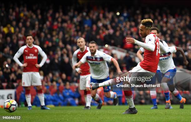 Pierre-Emerick Aubameyang of Arsenal scores his sides first goal from the penalty spot during the Premier League match between Arsenal and Stoke City...