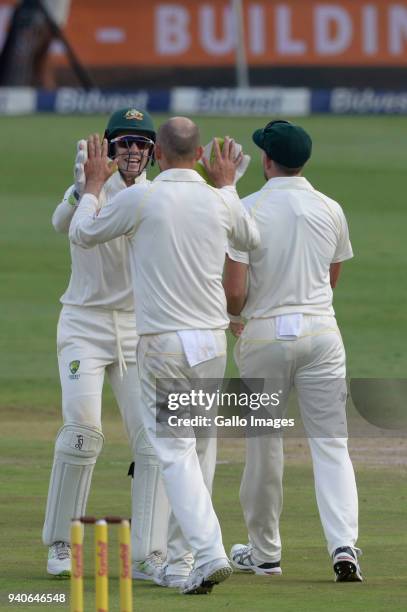 Tim Paine and Nathan Lyon of Australia celebrate the wicket of Hashim Amla of the Proteas during day 3 of the 4th Sunfoil Test match between South...