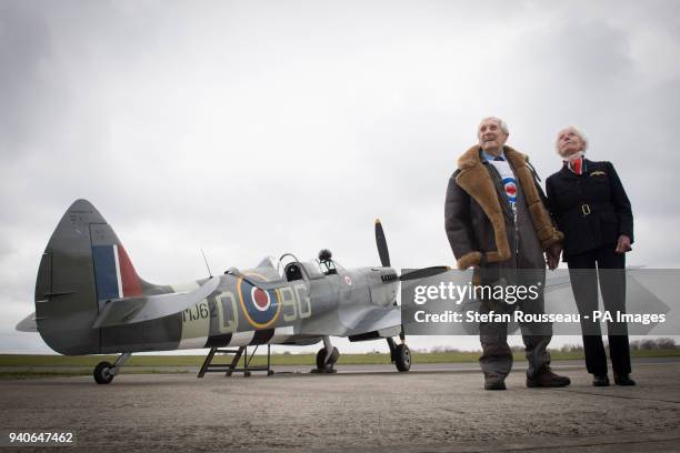 Former Spitfire pilot Squadron Leader Allan Scott prepares to fly as a passenger in a Spitfire watched by Mary Ellis the oldest surviving member of...