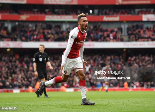 Pierre-Emerick Aubameyang of Arsenal celebrates after scoring his sides second goal during the Premier League match between Arsenal and Stoke City at...