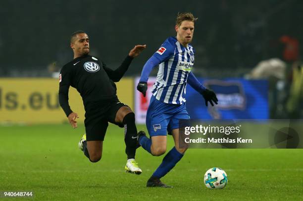 Arne Maier of Berlin battles for the ball with Jeffrey Bruma of Wolfsburg during the Bundesliga match between Hertha BSC and VFL Wolfsburg at...