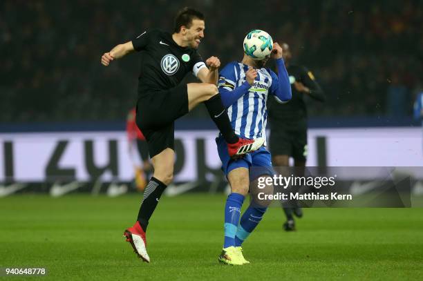 Vedad Ibisevic of Berlin battles for the ball with Ignacio Camacho of Wolfsburg during the Bundesliga match between Hertha BSC and VFL Wolfsburg at...