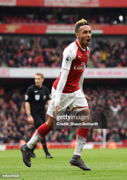 Pierre-Emerick Aubameyang of Arsenal celebrates after scoring his sides second goal during the Premier League match between Arsenal and Stoke City at...