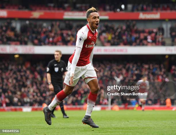 Pierre-Emerick Aubameyang of Arsenal celebrates after scoring his sides second goal during the Premier League match between Arsenal and Stoke City at...