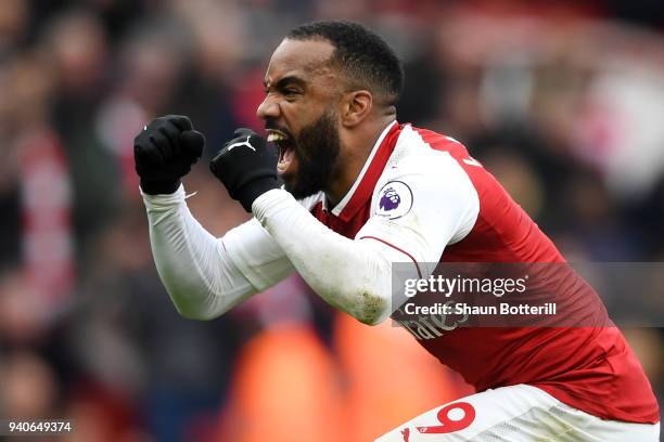 Alexandre Lacazette of Arsenal celebrates after scoring his sides third goal during the Premier League match between Arsenal and Stoke City at...