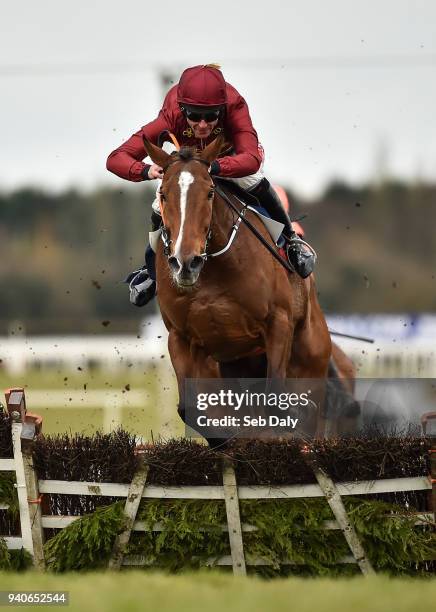 Meath , Ireland - 1 April 2018; Pallasator, with Davy Russell up, jumps the last on their way to winning the Underwriting Exchange Novice Hurdle on...