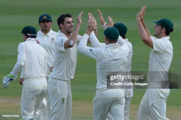 Pat Cummins of Australia celebrates the wicket of AB de Villiers of the Proteas with his team mates during day 3 of the 4th Sunfoil Test match...