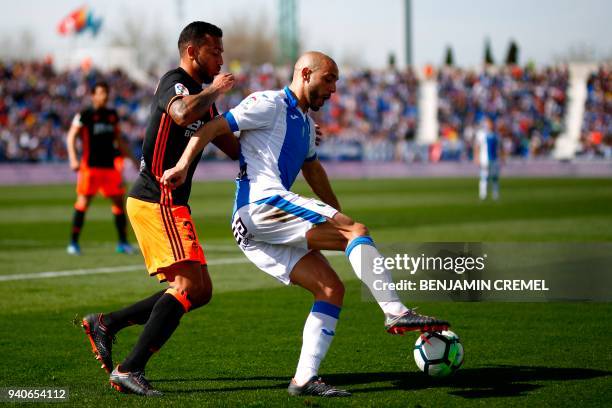 Leganes' Moroccan forward Nordin Amrabat challenges Valencia's Portuguese defender Ruben Vezo during the Spanish League football match between...