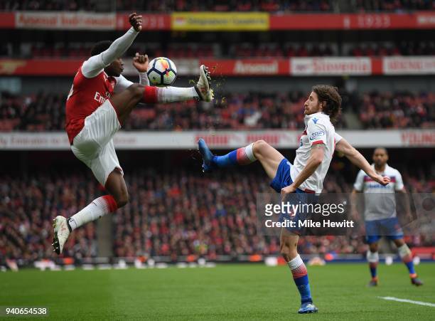 Danny Welbeck of Arsenal challenges Joe Allen of Stoke City during the Premier League match between Arsenal and Stoke City at Emirates Stadium on...
