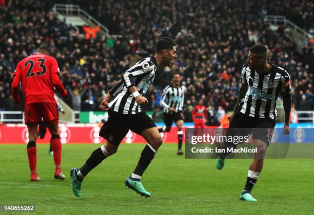 Ayoze Perze of Newcastle United celebrates with team mate Kennedy after scoring the only goal of the game during the Premier League match between...