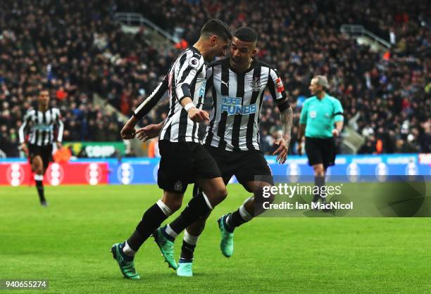 Ayoze Perze of Newcastle United celebrates with team mate Kennedy after scoring the only goal of the game during the Premier League match between...