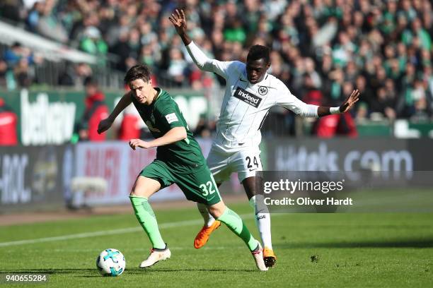 Marco Friedl of Bremen and Danny da Costa of Frankfurt compete for the ball during the Bundesliga match between SV Werder Bremen and Eintracht...
