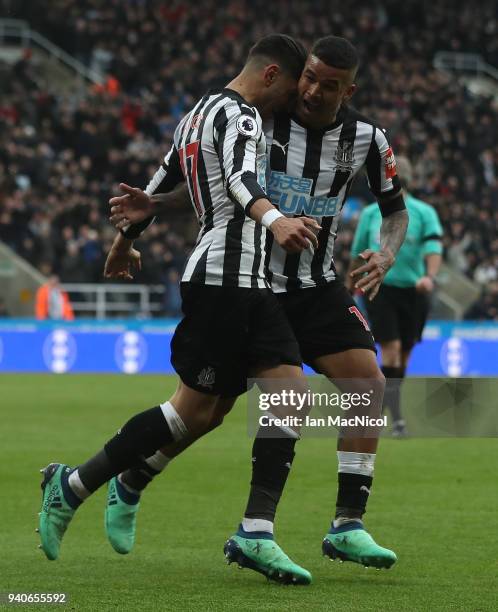 Ayoze Perze of Newcastle United celebrates with team mate Kennedy after scoring the only goal of the game during the Premier League match between...