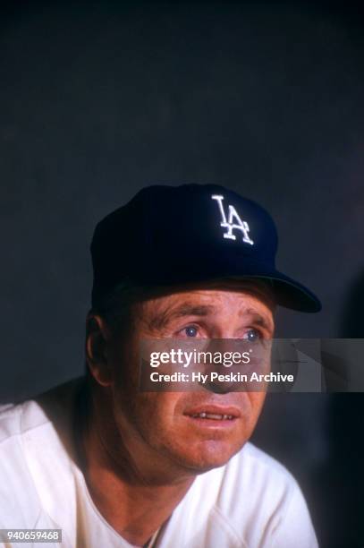 Manager Walter Alston of the Los Angeles Dodgers watches the action from the dugout during a Spring Training game against the Boston Red Sox circa...