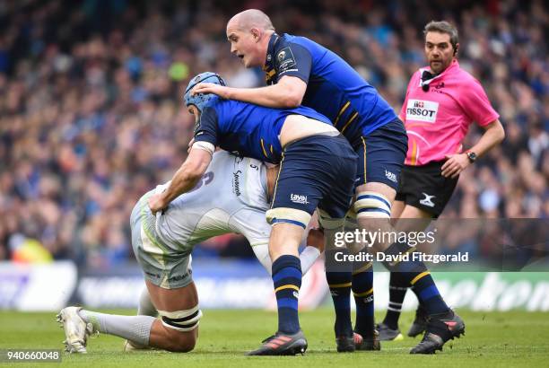 Dublin , Ireland - 1 April 2018; Nick Isiekwe of Saracens is tackled by Devin Toner, right, and Scott Fardy of Leinster during the European Rugby...