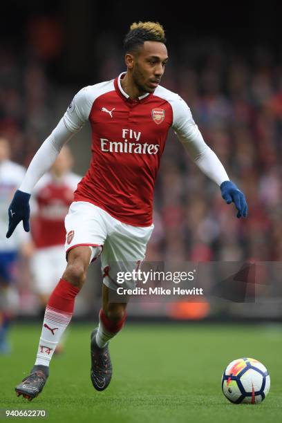 Pierre-Emerick Aubameyang of Arsenal in action during the Premier League match between Arsenal and Stoke City at Emirates Stadium on April 1, 2018 in...