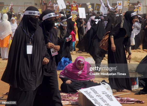 Thousands of Muslim women staged a silent protest march demanding withdrawal of the Bill banning triple talaq passed by Lok Sabha last December, at...