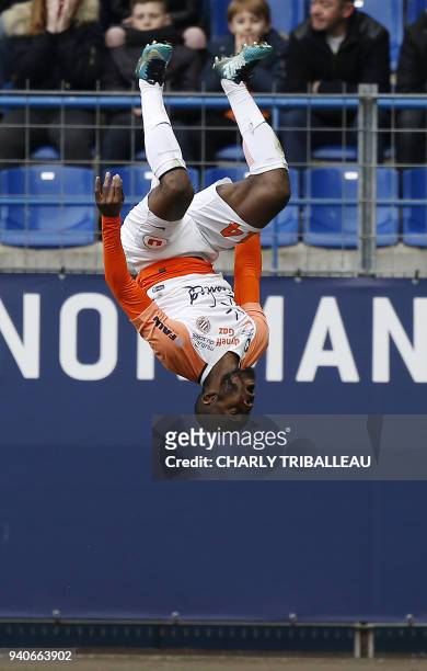 Montpellier's Ivorian forward Giovanni Sio celebrates after scoring a goal during the French L1 football match between Caen and Montpellier at The...