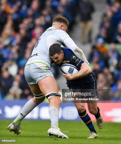 Dublin , Ireland - 1 April 2018; Jonathan Sexton of Leinster is tackled by Nick Isiekwe of Saracens during the European Rugby Champions Cup...