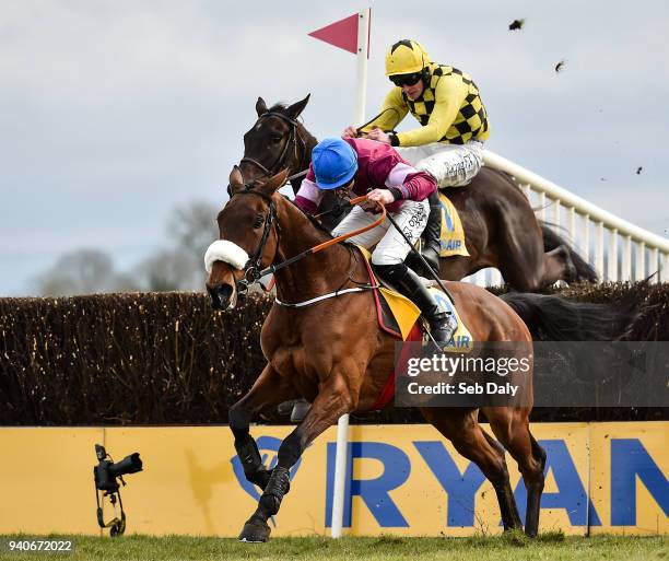 Meath , Ireland - 1 April 2018; Al Boum Photo, behind, with David Mullins up, jumps the last behind eventual second place Shattered Love, with Jack...