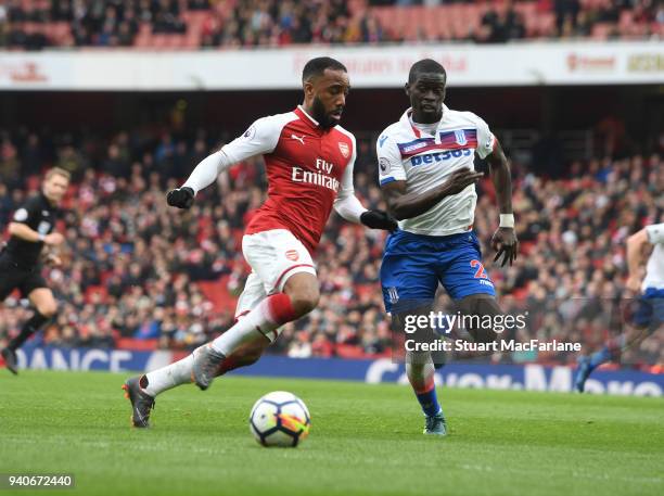 Alex Lacazette of Arsenal takes on Badou Ndiaye of Stoke during the Premier League match between Arsenal and Stoke City at Emirates Stadium on April...