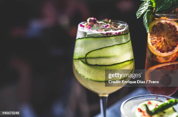 close up of cocktails on marble benchtop in bar - cucumber cocktail stock pictures, royalty-free photos & images