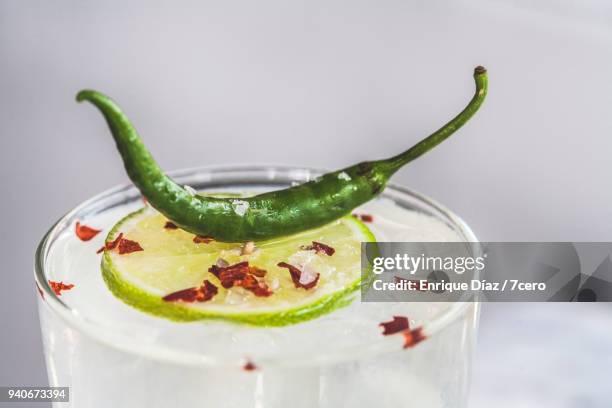 tequila and pineapple margarita with lime, chili and salt - mexican food and drink stock pictures, royalty-free photos & images