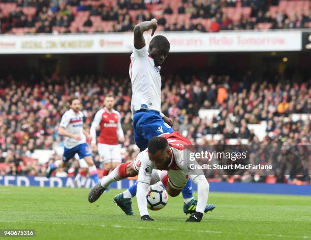 Alex Lacazette is tripped for the 2nd Arsenal penalty by Stoke defender Badou Ndiaye during the Premier League match between Arsenal and Stoke City...