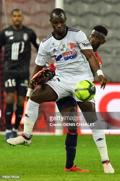 Amiens' Senegalese defender Issa Cissokho holds off Lille's South African forward Lebo Mothiba during the French L1 football match played behind...