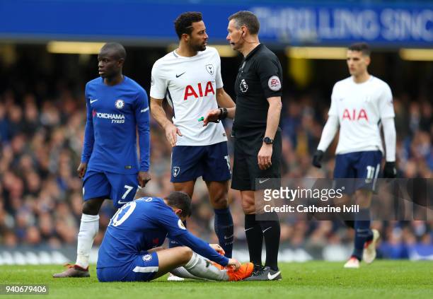 Referee Andre Marriner speaks to Mousa Dembele of Tottenham Hotspur during the Premier League match between Chelsea and Tottenham Hotspur at Stamford...