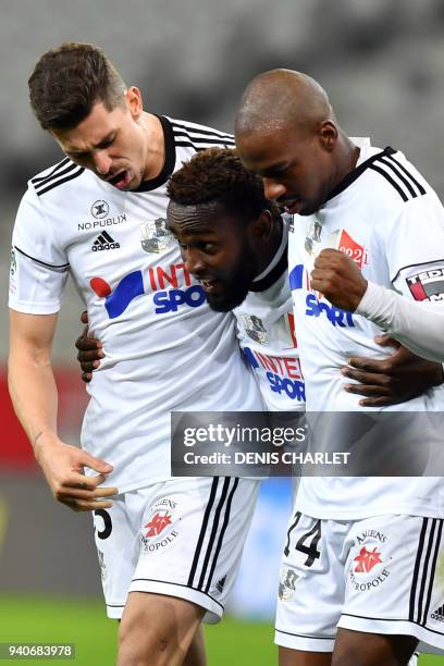Amiens' Colombian forward Stiven Mendoza celebrates with Amiens' Brazilian defender Danilo Fernando Avelar and Amiens' Congolese forward Gael Kakuta...