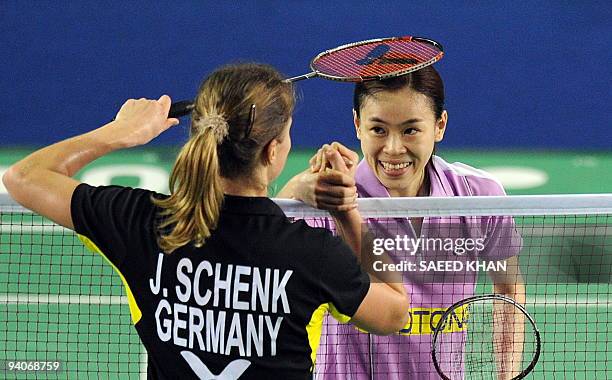Juliane Schenk of Germany congratulates Wong Mew Choo of Malaysia after Wong defeated her in the women's singles final at the Badminton World Super...