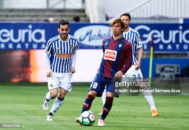Juan Miguel Jimenez 'Juanmi' of Real Sociedad duels for the ball with Takashi Inui of SD Eibar during the La Liga match between SD Eibar and Real...