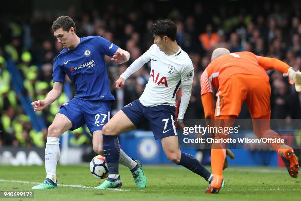 Andreas Christensen of Chelsea and Heung-Min Son of Tottenham battle for the ball after Chelsea goalkeeper Willy Caballero makes a save during the...