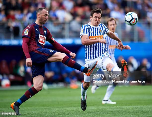 Mikel Oyarzabal of Real Sociedad duels for the ball with Ivan Ramis of SD Eibar during the La Liga match between SD Eibar and Real Sociedad de Futbol...