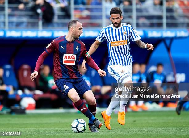 Willian Jose Da Silva of Real Sociedad duels for the ball with Ivan Ramis of SD Eibar during the La Liga match between SD Eibar and Real Sociedad de...