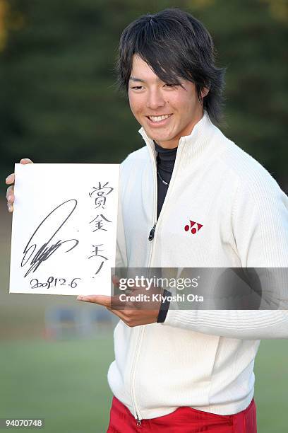 Ryo Ishikawa of Japan celebrates as he secures the 2009 JGTO tour money leader after the final round of the Nippon Series JT Cup at Tokyo Yomiuri...