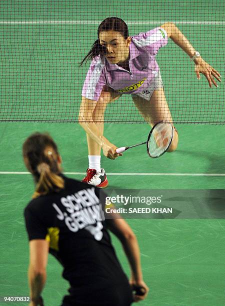 Wong Mew Choo of Malaysia competes against Juliane Schenk of Germany in the women's singles final at the Badminton World Super Series Masters finals...