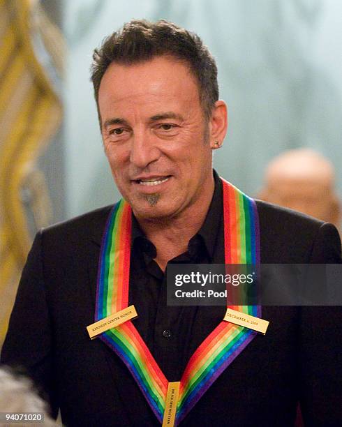 Kennedy Center honoree Bruce Springsteen poses for the formal group photo following the Artist's Dinner at the United States Department of State on...